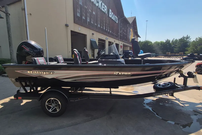 Slide: The Image of 2026 Ranger VS1782SC Reata boat on trailer outside Tracker Boats building. - 5