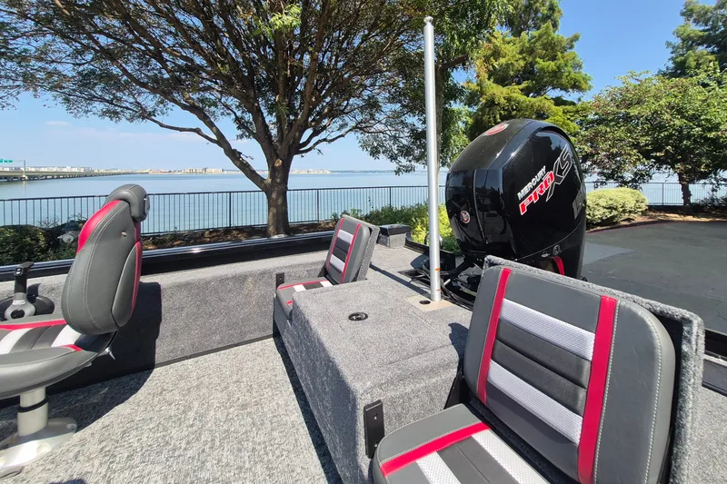 Slide: The Image of 2026 Ranger VS1782SC Reata boat interior with Mercury Pro XS engine by a scenic waterfront. - 15
