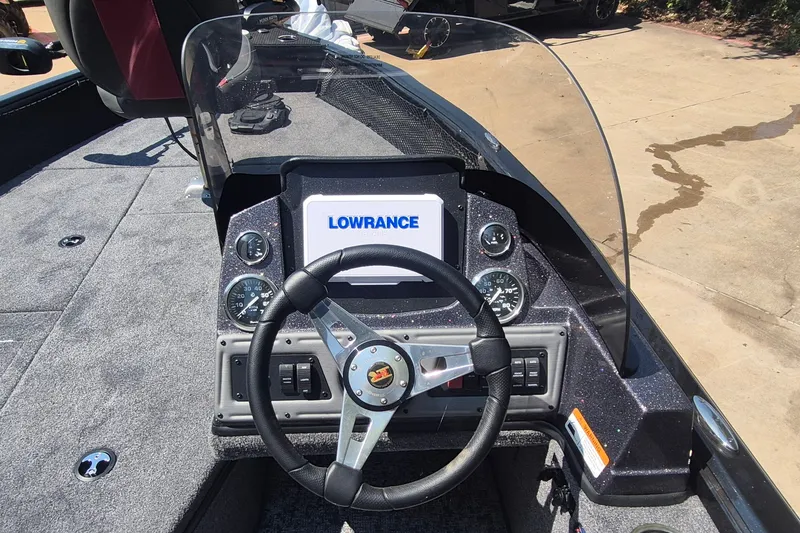 Slide: The Image of Cockpit of 2026 Ranger VS1782SC Reata boat with Lowrance display and steering wheel. - 11