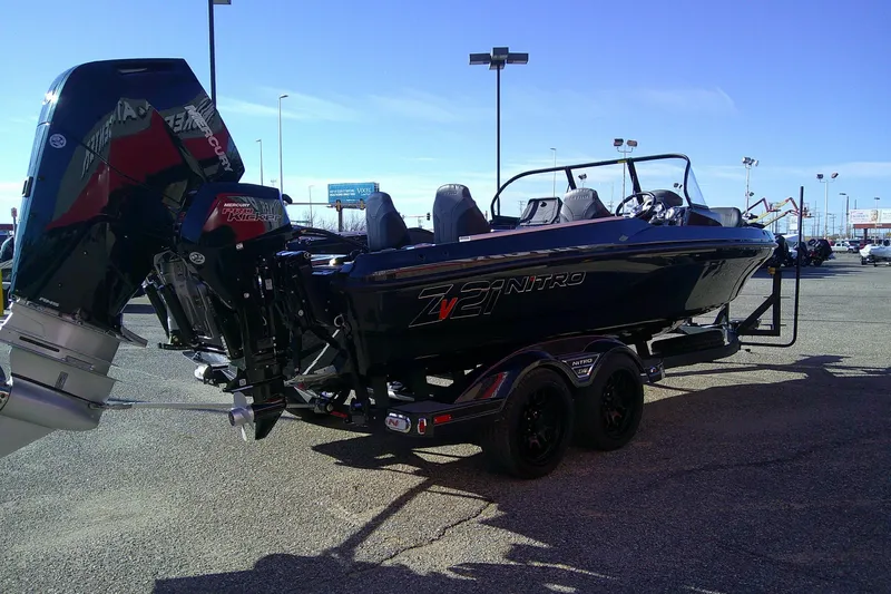 Slide: The Image of 2026 Nitro ZV21 Pro boat with powerful Mercury engine on a trailer. - 3