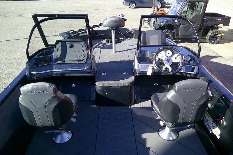 Slide: The Image of Interior of 2026 Nitro ZV21 Pro boat with dual seats and modern dashboard. - 4