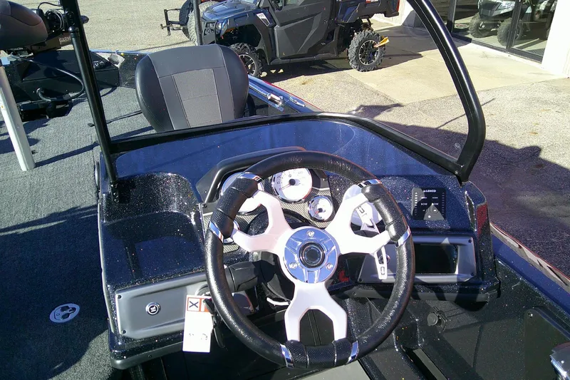 Slide: The Image of 2026 Nitro ZV21 Pro boat dashboard with steering wheel and gauges. - 7