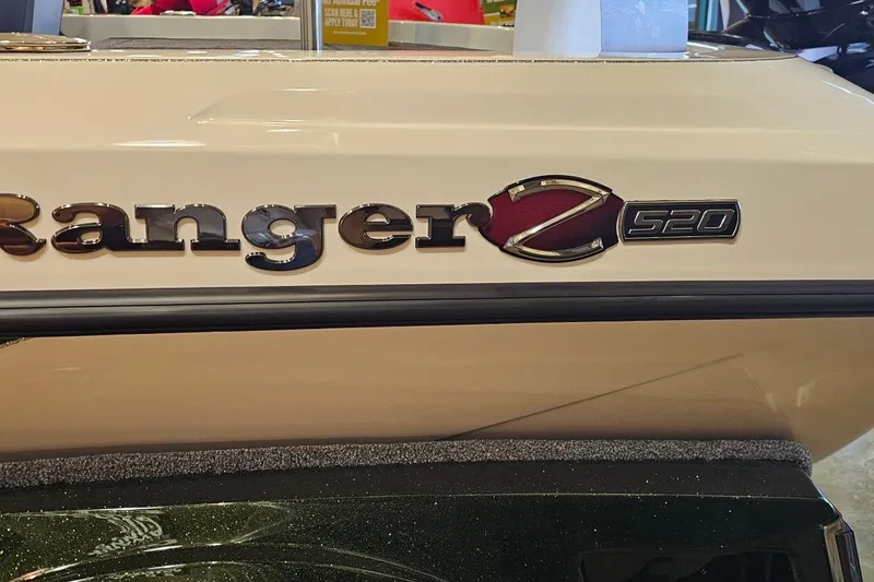 Slide: The Image of 2026 Ranger Z520 boat logo on beige surface, showcasing sleek design. - 2