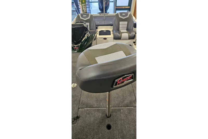 Slide: The Image of 2026 Ranger Z520 boat interior with cushioned seating and carpeted flooring. - 4