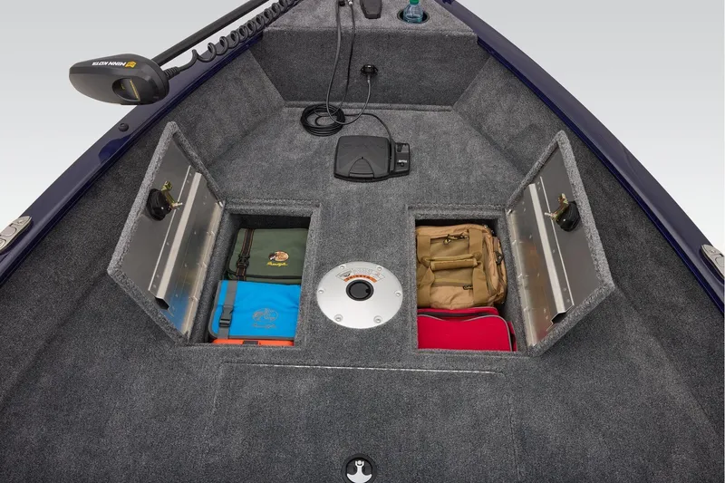 Slide: The Image of 2026 Tracker Super Guide V-16 T boat with a 40 HP motor, parked outdoors. - 11