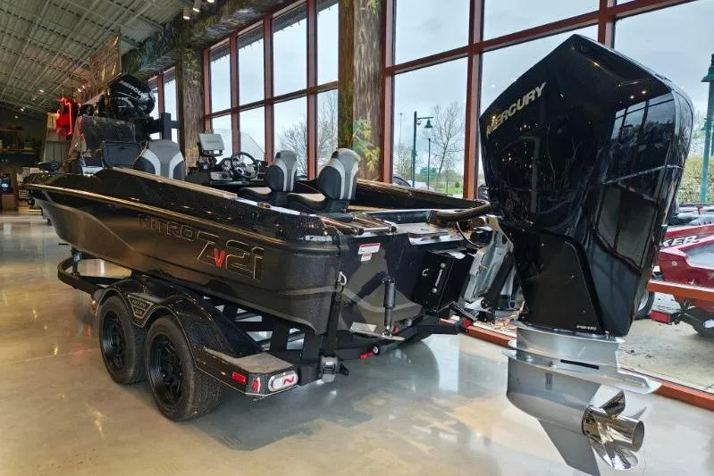 Slide: The Image of 2026 Nitro ZV21 boat with Mercury engine displayed indoors. - 12