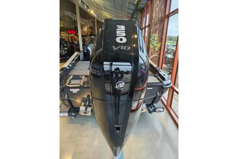 Slide: The Image of 2026 Nitro ZV21 boat with powerful 350 V10 engine displayed indoors. - 13