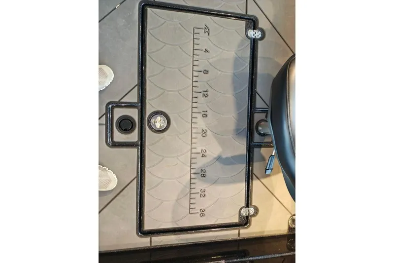 Slide: The Image of Ruler on Nitro ZV21 boat floor, 2026 model, with measurement markings. - 15