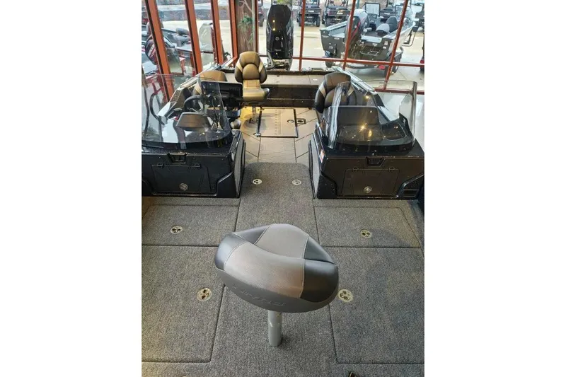 Slide: The Image of Interior view of 2026 Nitro ZV21 boat, featuring seating and dashboard. - 17