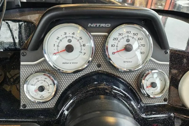 Slide: The Image of Dashboard of a 2026 Nitro ZV21 boat with RPM and speed gauges. - 18