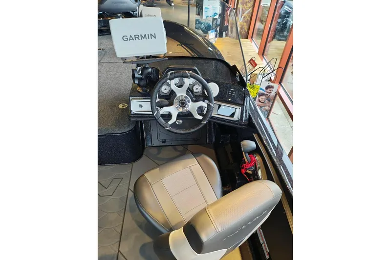 Slide: The Image of Interior of 2026 Nitro ZV21 boat with Garmin navigation system and steering wheel. - 19