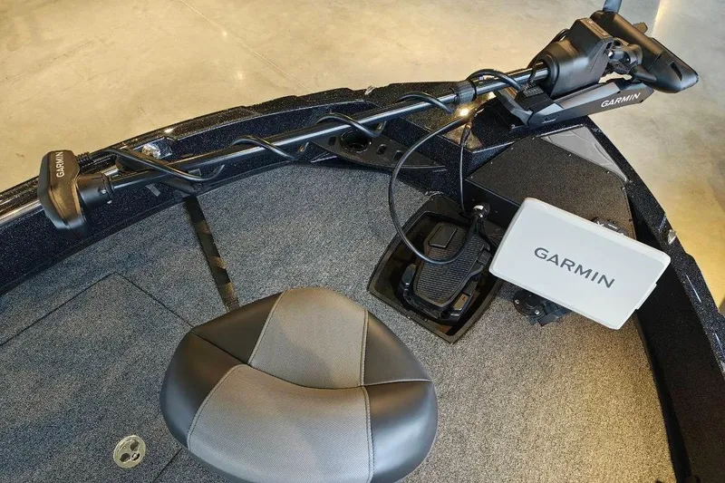 Slide: The Image of Interior of 2026 Nitro ZV21 boat with Garmin navigation system and seating. - 21