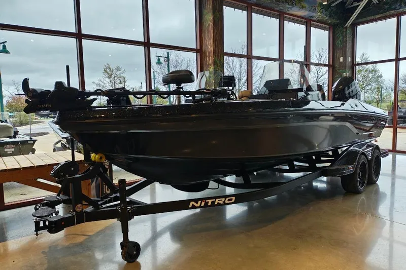 Slide: The Image of 2026 Nitro ZV21 boat displayed indoors on a trailer. - 22