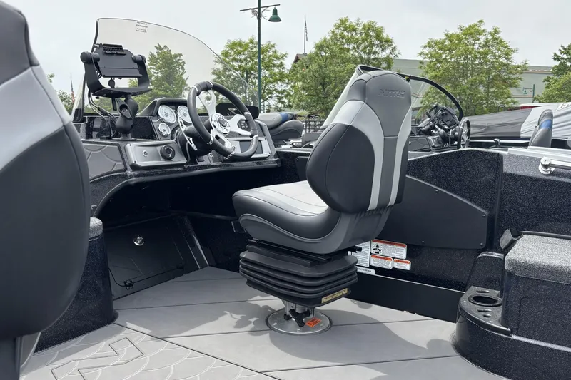 Slide: The Image of Interior of 2026 Nitro ZV21 boat featuring modern steering and seating. - 29