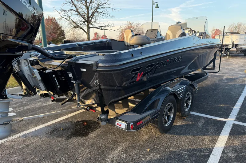 Slide: The Image of 2026 Nitro ZV21 boat on trailer, parked outdoors, showcasing sleek design and powerful engine. - 3