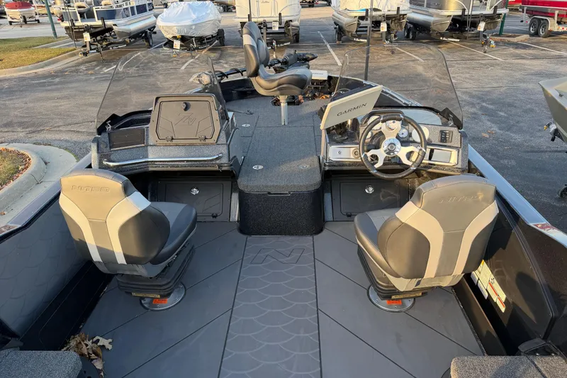 Slide: The Image of 2026 Nitro ZV21 boat interior with dual seats, steering wheel, and Garmin navigation system. - 4