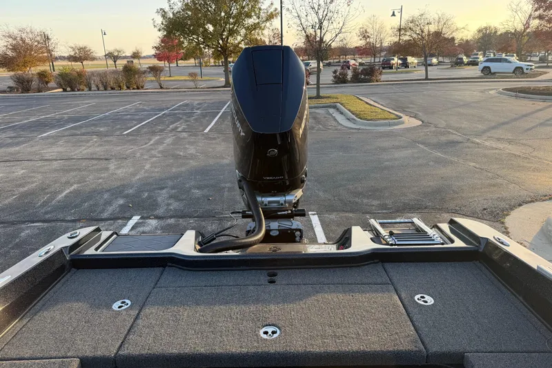 Slide: The Image of 2026 Nitro ZV21 boat with Mercury outboard motor in a parking lot. - 5