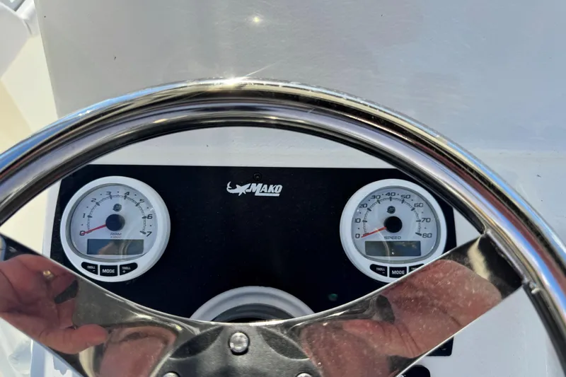 Slide: The Image of Steering wheel and gauges of 2026 Mako 214 Center Console boat dashboard. - 3