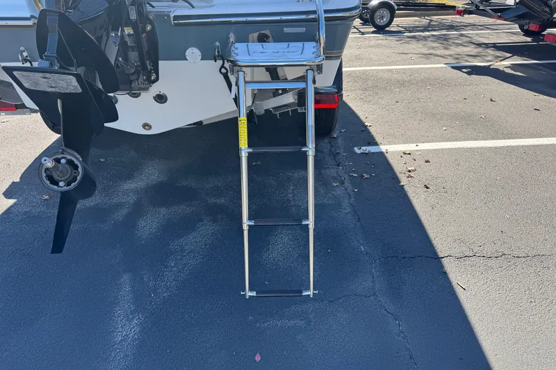 Slide: The Image of Rear view of 2026 Mako 214 Center Console boat with ladder and propeller. - 4