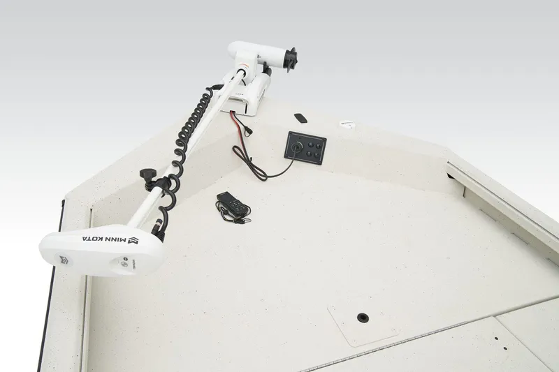 Slide: The Image of 2026 Ranger RB190 boat with camouflage seating and motor, parked outdoors. - 20