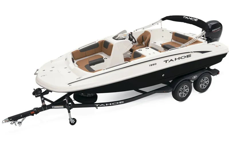 The Image of 2026 Tahoe 1950 boat on display in a showroom, featuring a sleek blue and white design. - 0