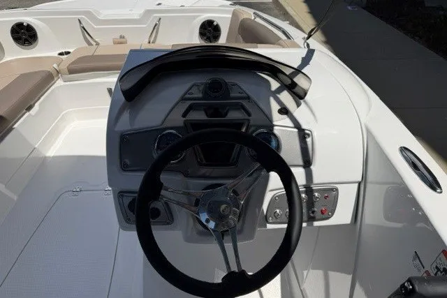 Slide: The Image of Steering console of a 2026 Tahoe 1950 boat with modern controls and seating. - 8