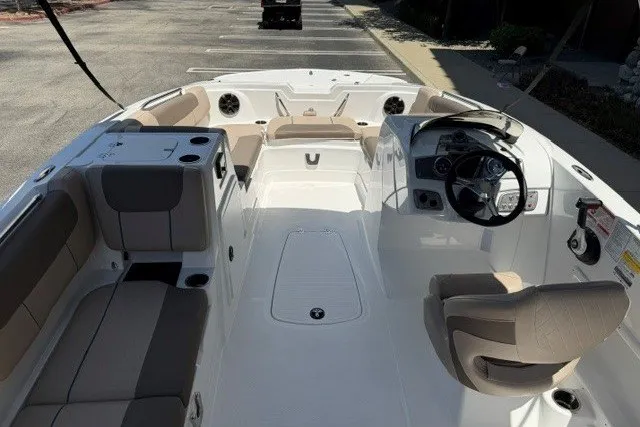 Slide: The Image of Interior view of a 2026 Tahoe 1950 boat, featuring spacious seating and modern controls. - 7