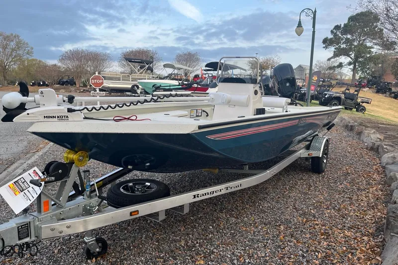 Slide: The Image of 2026 Ranger RB190 boat on trailer, featuring Minn Kota trolling motor, parked outdoors. - 0