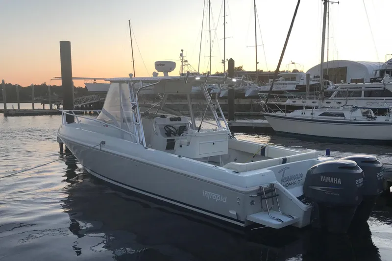 Slide: The Image of 1996 Intrepid 337 boat docked at sunset with Yamaha engines. - 1