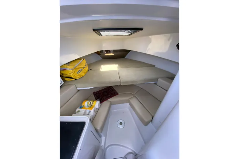 Slide: The Image of Interior cabin of a 1996 Intrepid 337 boat with seating and storage. - 10