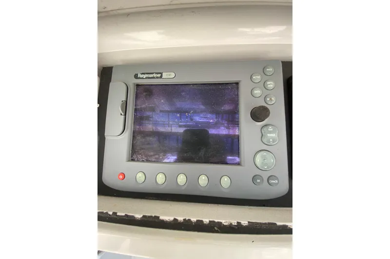 Slide: The Image of Raymarine navigation display on a 1996 Intrepid 337 boat dashboard. - 11
