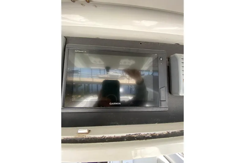 Slide: The Image of Garmin GPS display on 1996 Intrepid 337 boat dashboard. - 14