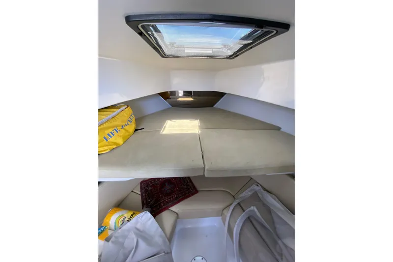 Slide: The Image of 1996 Intrepid 337 cabin interior with cushions, skylight, and life jacket. - 15