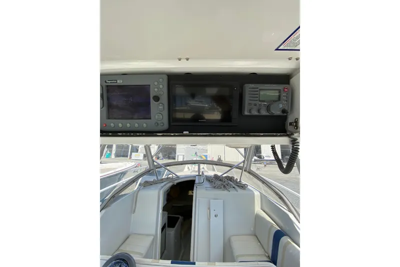 Slide: The Image of 1996 Intrepid 337 boat interior with navigation equipment and seating area. - 28