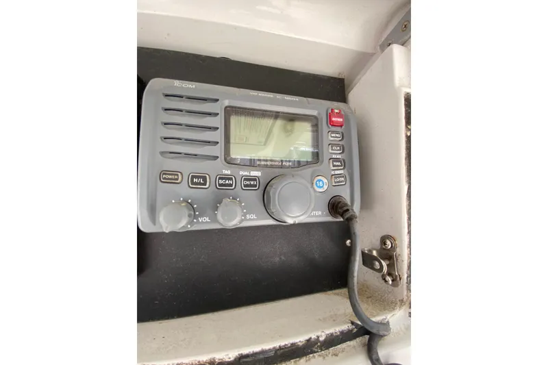 Slide: The Image of Marine radio equipment on a 1996 Intrepid 337 boat dashboard. - 42