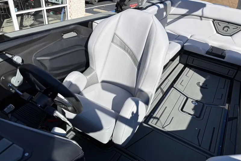 Slide: The Image of Interior of a 2026 Centurion Nv243 boat with sleek seating and modern design. - 12