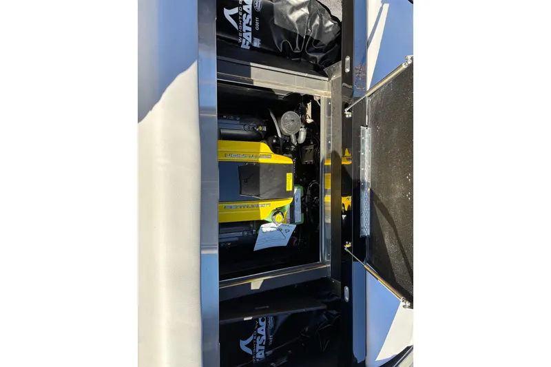 Slide: The Image of Engine compartment of 2026 Centurion Nv243 boat, showcasing detailed mechanical components. - 14