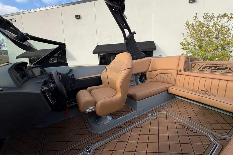 Slide: The Image of 2026 MB B52 21 Alpha boat interior with tan leather seats and modern dashboard. - 29