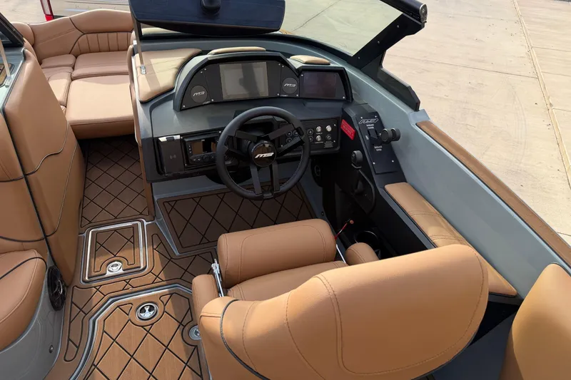 Slide: The Image of 2026 MB B52 21 Alpha boat interior with tan leather seats and modern dashboard. - 30