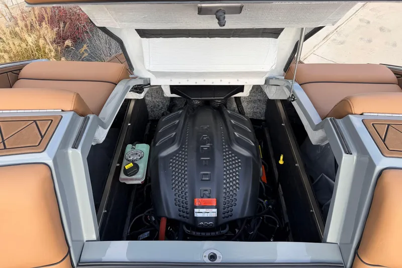 Slide: The Image of 2026 MB B52 21 Alpha boat engine compartment with Raptor engine and tan seating. - 31