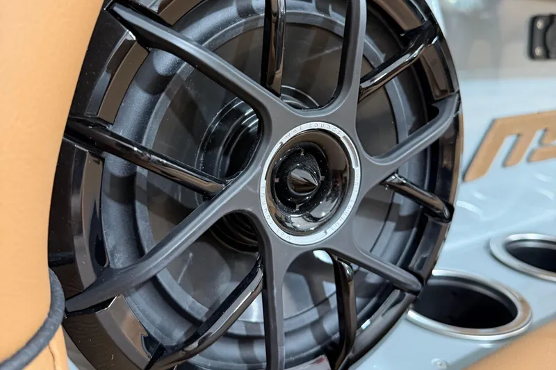 Slide: The Image of Close-up of MB B52 21 Alpha 2026 speaker with sleek black design. - 36