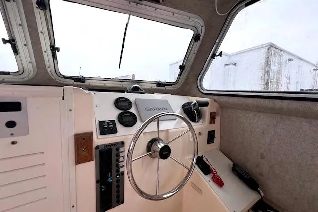 Slide: The Image of 2005 Parker 2520 Modified Vee Sport Cabin helm with Garmin navigation system. - 6