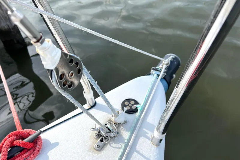 Slide: The Image of Bow of 2015 Wraceboats GP26 sailboat with rigging details and water reflection. - 15