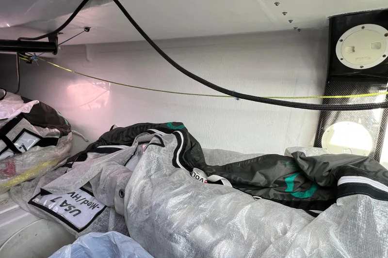 Slide: The Image of Interior of 2015 Wraceboats GP26 sailboat with stored sails and equipment. - 19