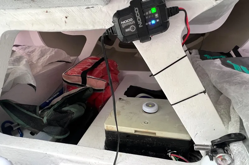 Slide: The Image of Interior of 2015 Wraceboats GP26 with equipment and NOCO Genius charger. - 21
