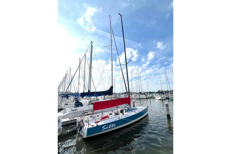 Slide: The Image of Sailboat Wraceboats GP26 2015 docked in a marina under a blue sky. - 3