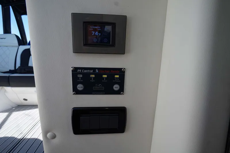 Slide: The Image of Control panel inside 2020 Concept 44' Cuddy Cabin boat, featuring digital and manual controls. - 16