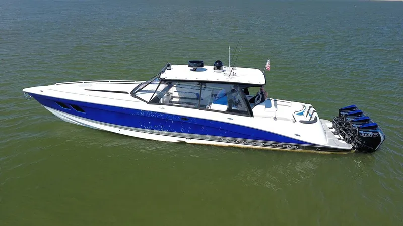 Slide: The Image of 2020 Concept 44' Cuddy Cabin boat with blue and white design on calm water. - 5