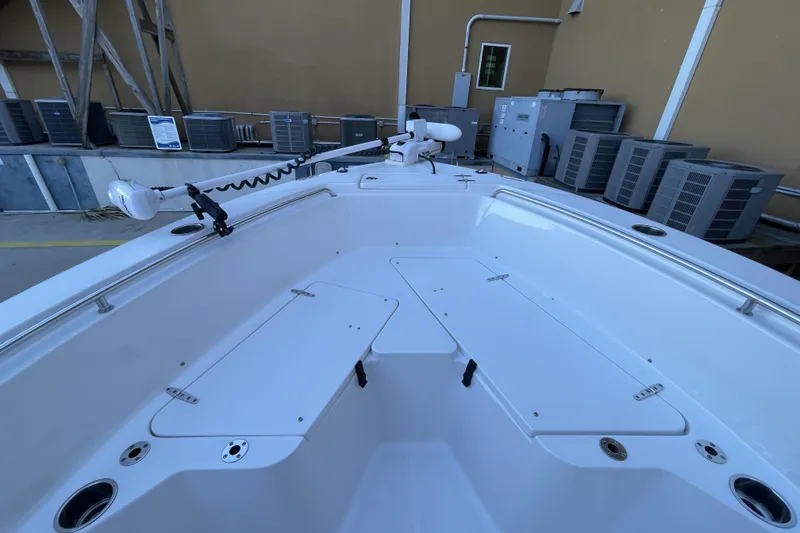 Slide: The Image of 2017 Sea Hunt Triton 210 boat deck with storage compartments and mounted equipment. - 13