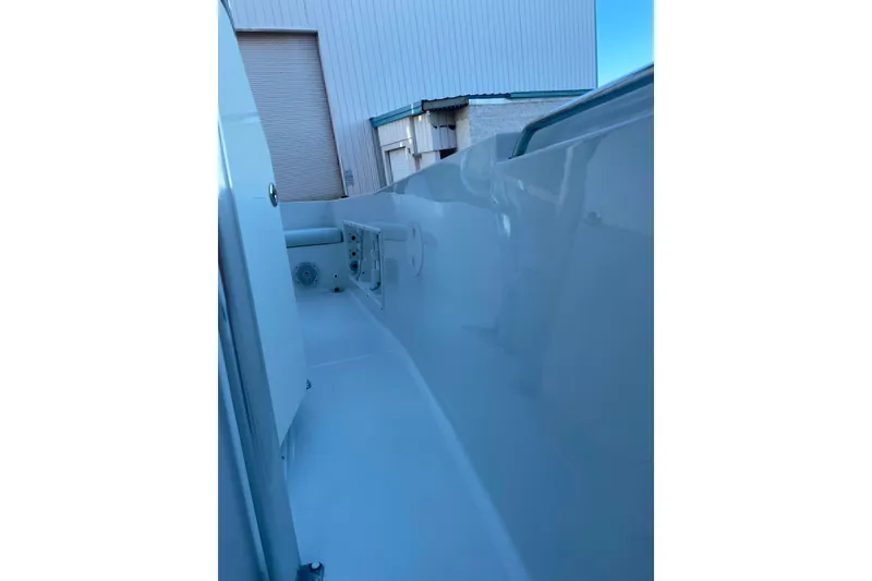 Slide: The Image of 2017 Sea Hunt Triton 210 boat interior, showcasing sleek design and storage compartments. - 17